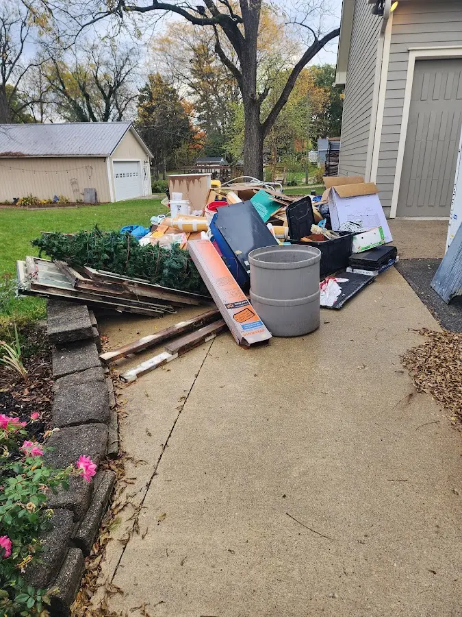 Dumpster being loaded with debris for Commercial Dumpster Rental in Covedale